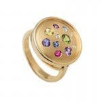 Fancy Color Sapphire Galaxy Ring yellow gold fancy color sapphire round galaxy ring from the Brown Goldsmiths Signature Ring Collection